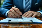 Businessman, signing and contract or anonymous person sitting in office, boardroom or desk. Document, closeup and  background for business, agreements and negotiation in modern corporate scene