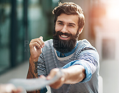 Buy stock photo Cropped shot of a creative businessperson handing a file to his colleague