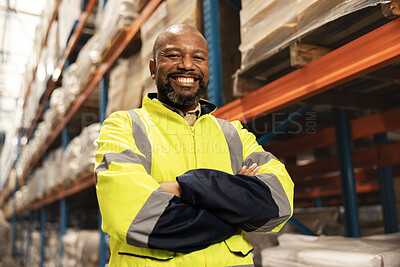 Happy, portrait and black man with confidence in warehouse for logistics, supply chain or storage management. African male person or employee with smile and arms crossed in shipping industry at depot