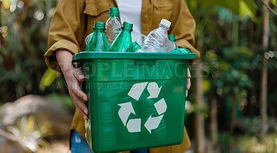 Hand, recycle and volunteer holding a dustbin for environmental, awareness and sustainability concept. Protest, plastic and green design with copyspace for Earth Day background, eco system or ecology