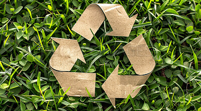 Recycle, sign and cardboard on nature background for environmental, awareness and sustainability concept. Green grass, mockup and symbol with copyspace for Earth Day, eco system and ecology logo