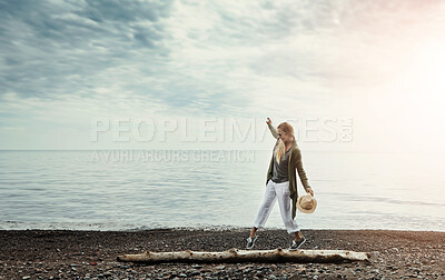 Buy stock photo Walking, beach and woman on log for travel, vacation or holiday adventure in Australia. Fun, nature and female person on wood tree branch for balance by ocean on tropical, calm and peace weekend trip