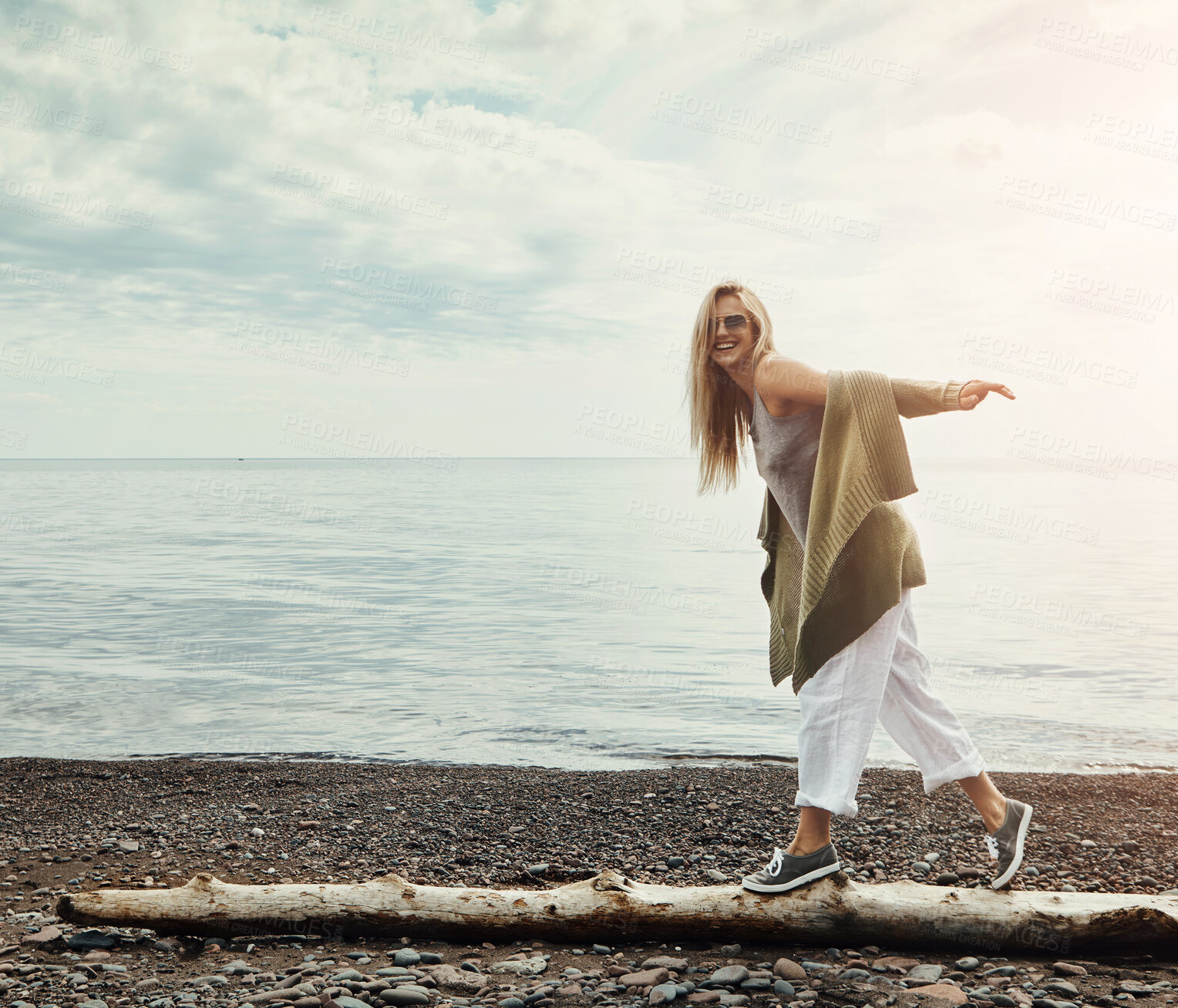 Buy stock photo Walking, branch and portrait of woman by beach on adventure, holiday or weekend trip with exploring. Space, outdoor and female person on wood log for balance by ocean on seaside vacation for travel.