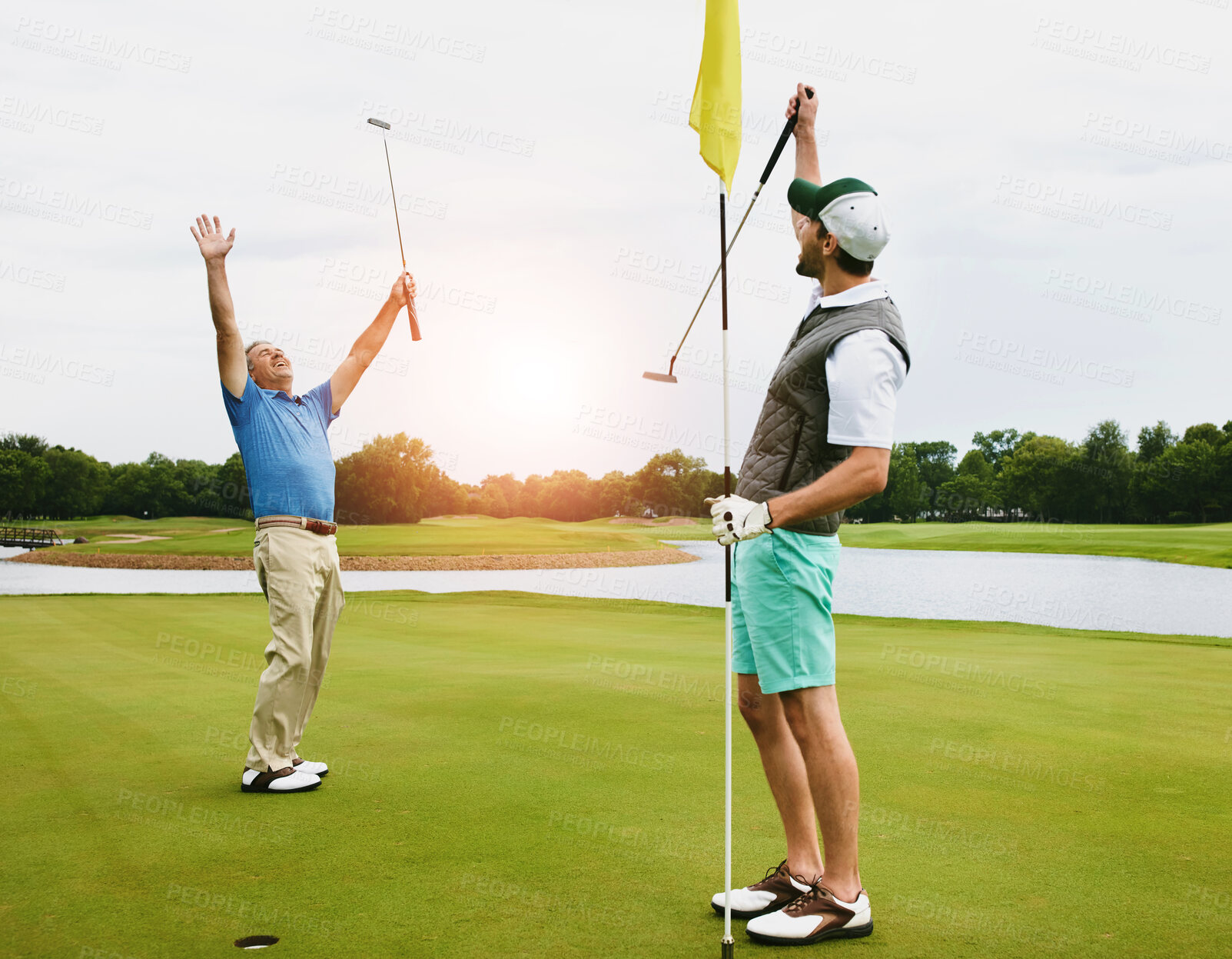 Buy stock photo People, together or celebrate on golf course for winning put, success with sports challenge or competition. Outdoor, exercise or healthy men on green with flag, excited for performance with par score
