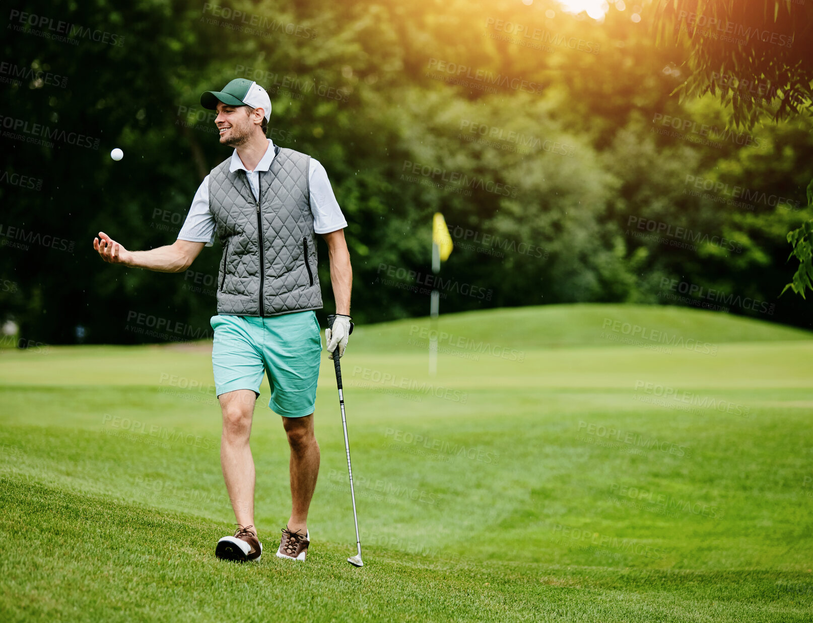 Buy stock photo Man, golf and walking with ball in air, exercise or happiness for birdie success or handicap achievement. Male athlete, game or smile with driver on course, outdoor for sports challenge with par hole