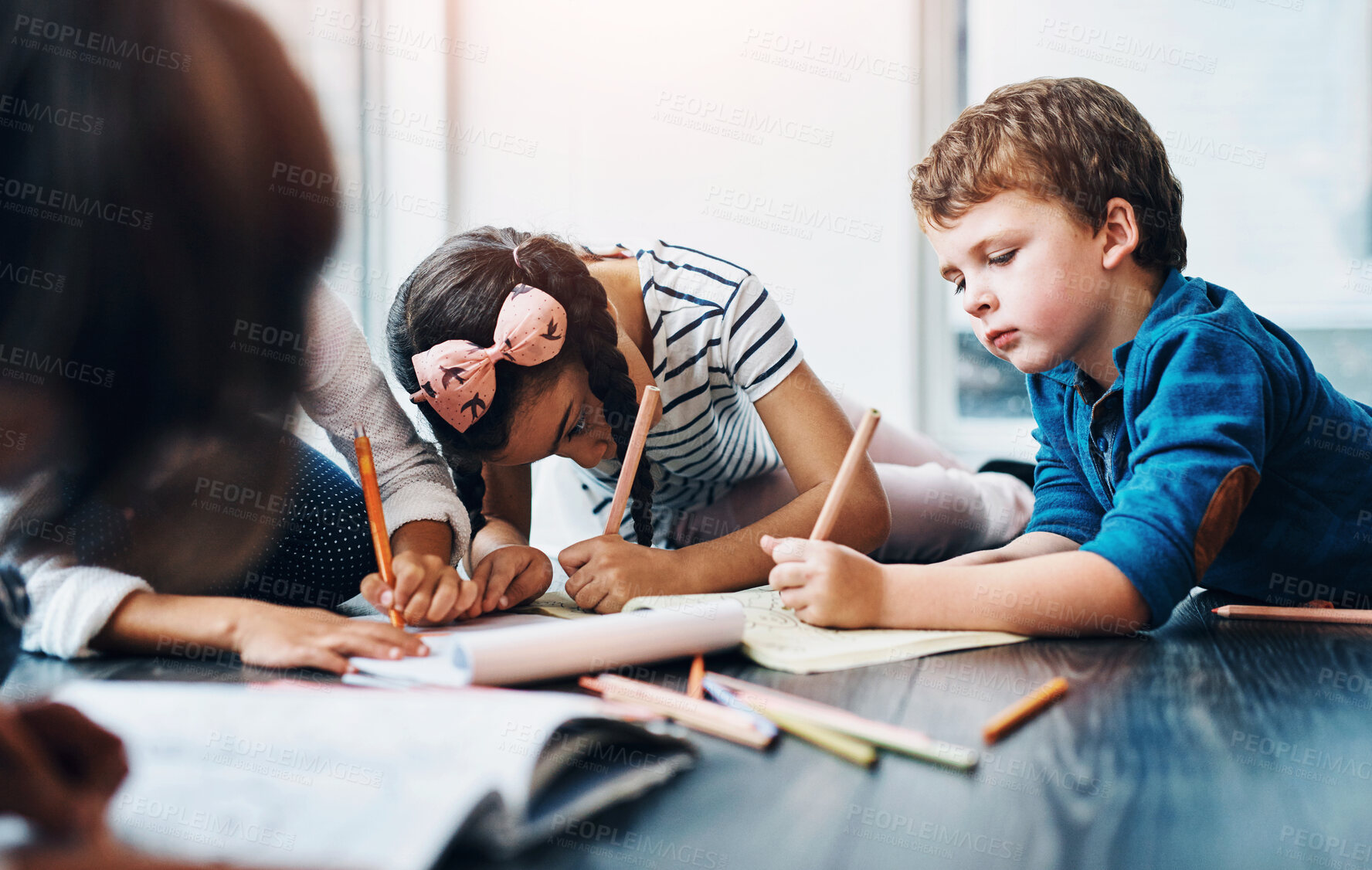 Buy stock photo Drawing, color and children on floor with paper for creative lesson, learning and child development at kindergarten. School, youth academy and kids with crayons for education, creativity and writing