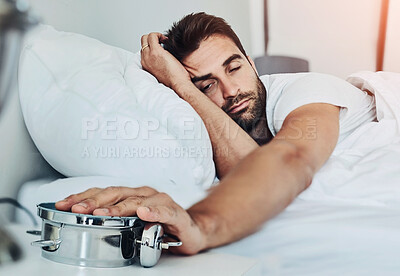 Buy stock photo Alarm clock snooze, hand and tired man in bed frustrated by insomnia, exhaustion and depression at home. Time, stop and sleepy person in bedroom with fatigue, burnout and annoyed by alert sound