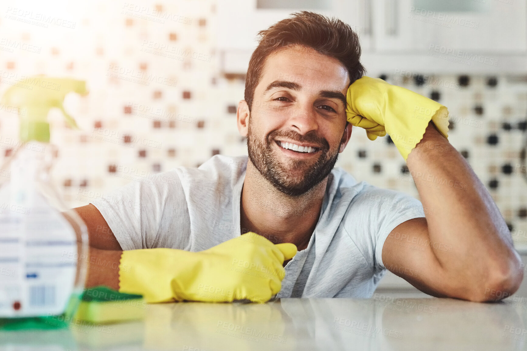 Buy stock photo Cleaning, happy and portrait of man in home with gloves for hygiene, disinfection and washing. Housekeeping, housework and person with spray bottle, products and detergents for cleaner service