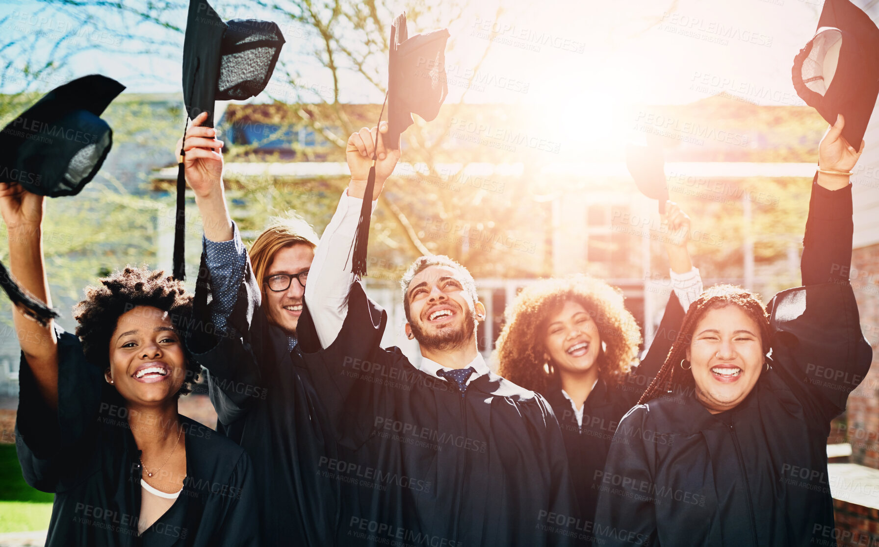 Buy stock photo Happy, graduation and portrait of people at university for celebration, achievement or goal for future. Excited, education and student graduates with pride for college accomplishment at campus.
