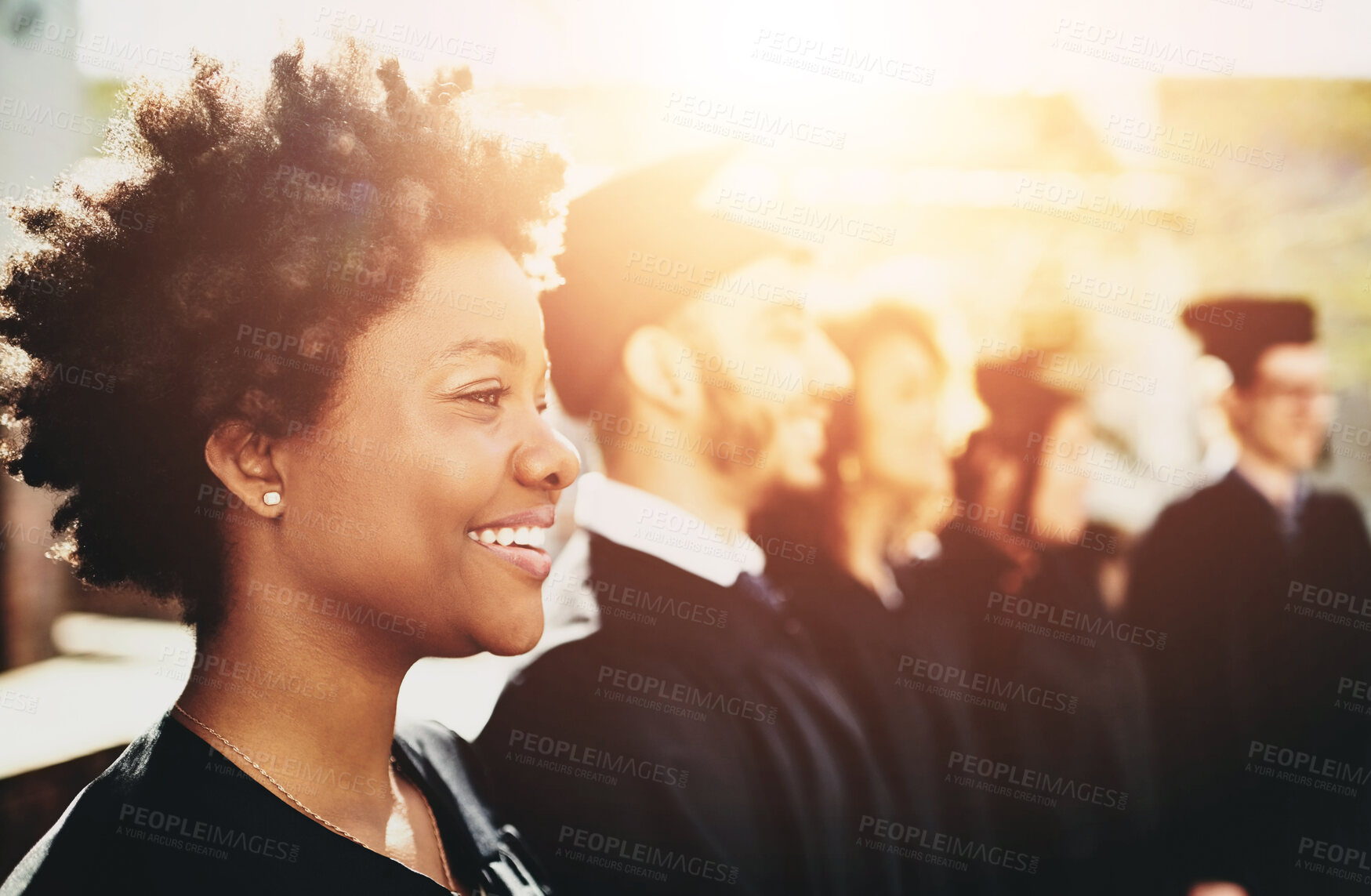 Buy stock photo Group, people and row at university graduation, happiness for degree or diploma event. Team, graduates and solidarity with smile for achievement at college, pride for education award with lens flare