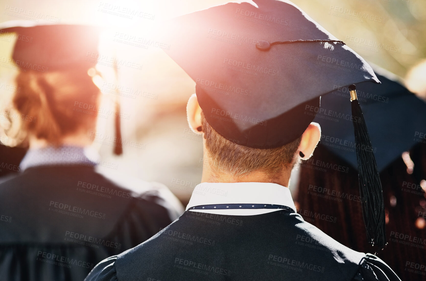 Buy stock photo Graduation cap, back and students at university event on campus with education, opportunity and achievement. College, scholarship and group of people at ceremony with knowledge, learning and progress