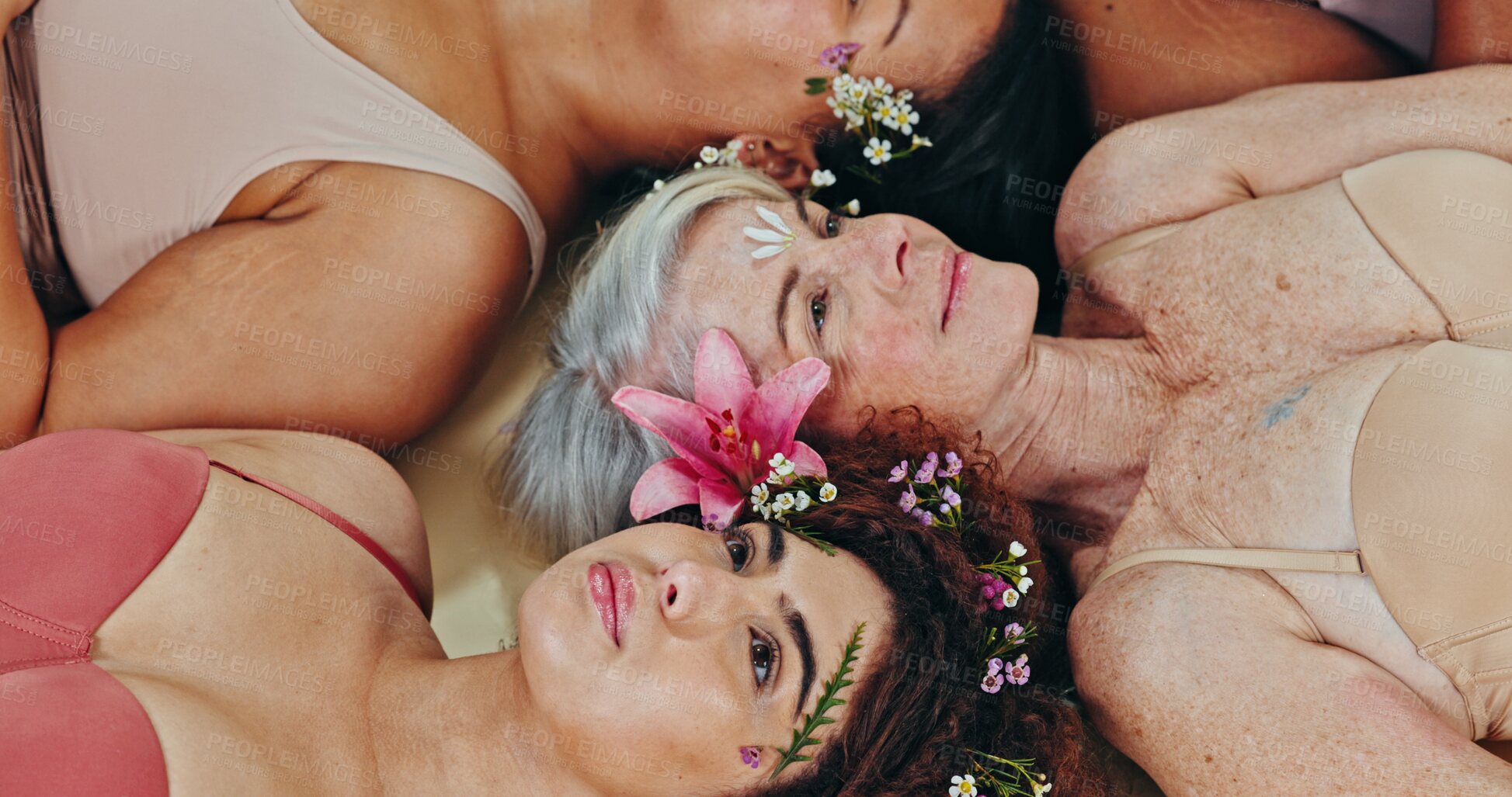 Buy stock photo Diversity, face flowers or women smile with self love, natural beauty glow or eco skincare wellness on studio background. Aesthetic group, sustainable creative design or floral friends laugh on floor