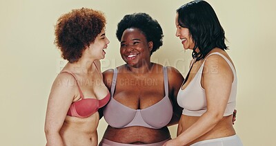 Body positive, diversity and women hug, smile and happy for self love, natural beauty or inclusivity. Woman empowerment, group inclusion and support friends in lingerie underwear on studio background