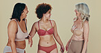 Body positive, diversity and women hug, smile and happy for self love, natural beauty or inclusivity. Woman empowerment, group inclusion and support friends in lingerie underwear on studio background