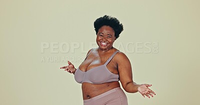 Dancing, body positivity and face of black woman in underwear in a studio for self love celebration. Happy, smile and portrait of young African female model moving with confidence by green background