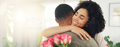 Couple, hug and flowers gift for valentines day with love for surprise bouquet for relationship, anniversary or date. Man, woman and embrace in home with roses for marriage, celebration or present