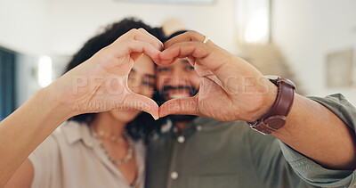 Man, woman and portrait with heart hands for valentines day with smile, care and marriage in home. Happy couple, celebration and emoji for love, romance and commitment to relationship in apartment.