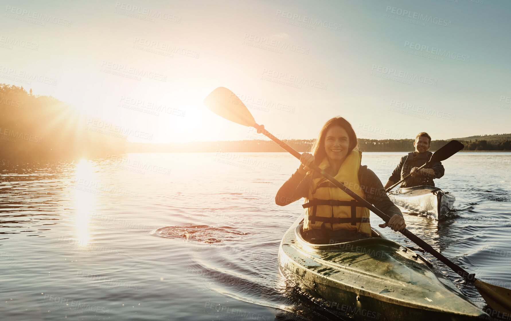 Buy stock photo Couple, happy and lake outdoor for kayak or water sports in nature, paddling and rowing together for river journey. Man, woman and adventure date for bonding with love, fun and summer travel vacation