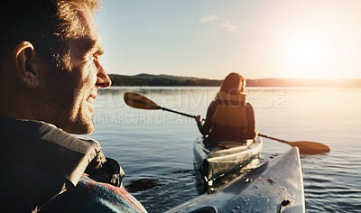 Buy stock photo Adventure, man and woman on lake with rowing, exercise and travel with rear view. Couple, together and kayak in ocean for holiday, vacation and freedom in evening for support, trust or love at sunset