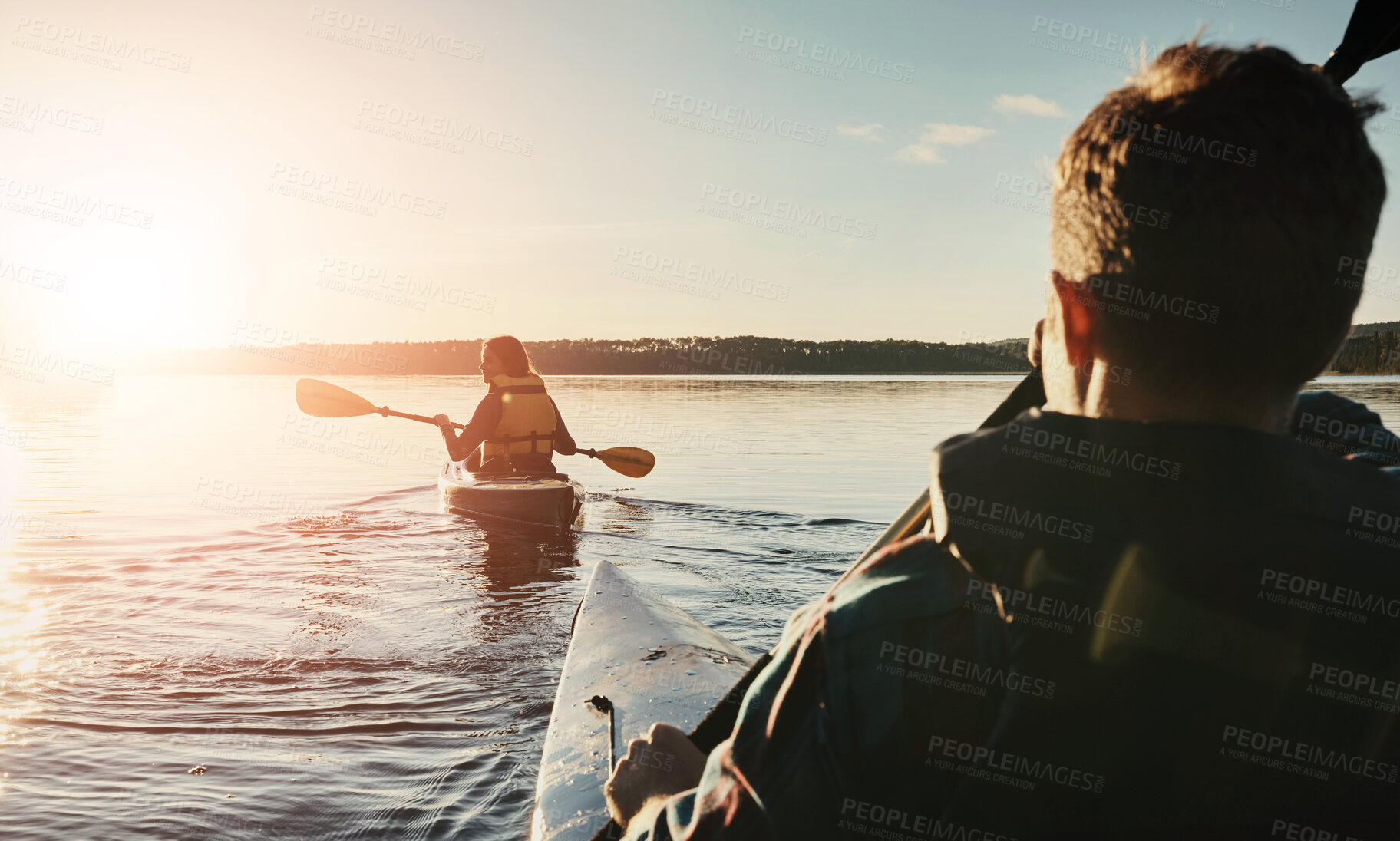 Buy stock photo Adventure, couple and kayak on lake for travel, wellness or rear view at sunset. Happy woman, man or canoeing on water for journey, vacation or scenery in evening for bonding, trust or love in nature