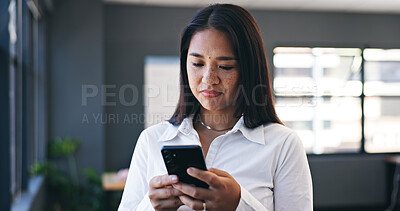 Phone, networking and business woman in the office browsing on social media or the internet. Smile, research and professional Asian female person scroll on mobile app with cellphone in workplace.