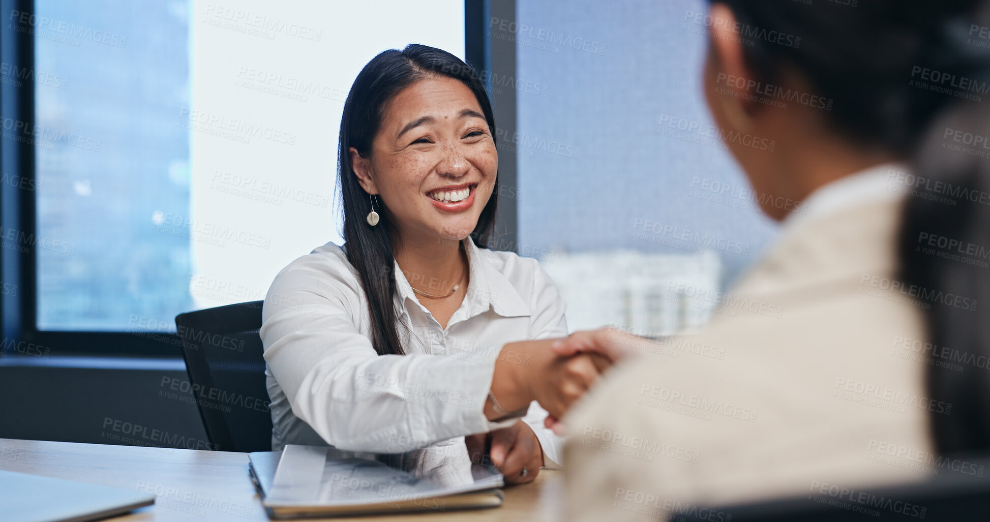 Buy stock photo Business, woman and handshake in job interview for introduction in meeting with smile or excited in office. Asian candidate, hr employee or shaking hands with documents for hiring deal or recruitment