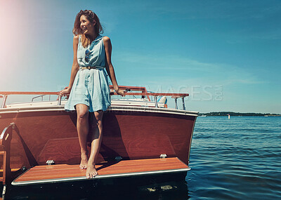 Buy stock photo Blue sky, standing and woman on boat for travel, vacation or holiday by ocean with adventure. Happy, explore and female person on deck of yacht by sea water for tropical summer weekend trip in Italy.