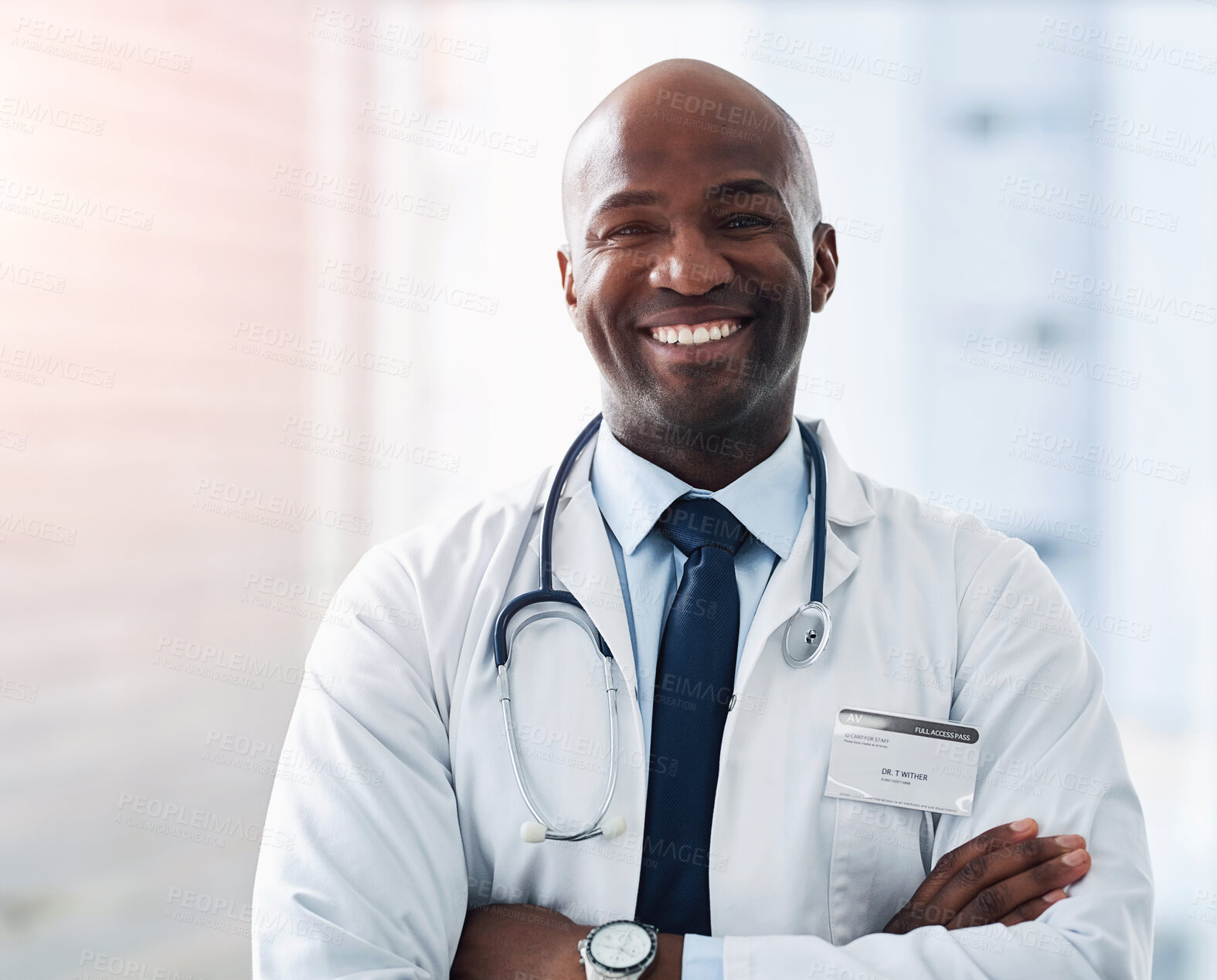 Buy stock photo Healthcare, portrait and happy doctor with arms crossed at hospital for help, treatment and service pride. Face, smile and African man medic with stethoscope for cardiovascular, consulting or exam