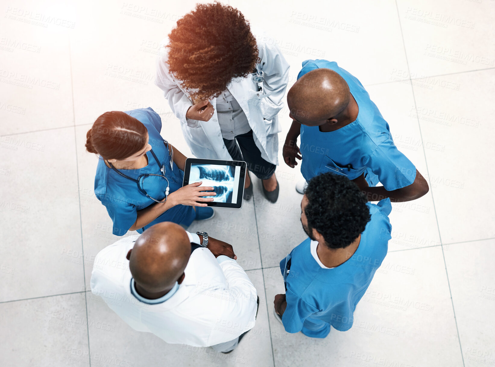 Buy stock photo Top view, tablet screen and doctors in lobby, xray or teamwork for surgery feedback. Specialist, medical or professional with tech, advice or collaboration for healthcare, review results or people