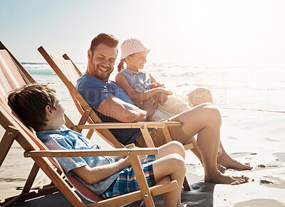 Buy stock photo Happy family, chair and smile at beach in summer to relax, travel and holiday in Miami on Independence day. Parents, children and people at ocean for vacation, bonding and sunset together on sand