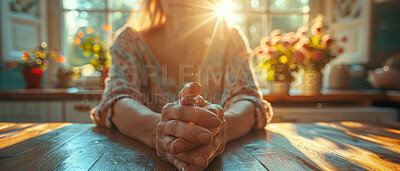 Close up, elderly and hands. Portrait, senior and sitting at kitchen table. Retirement, helpful and healthcare concept. Wellbeing, depression and caregiving with background sunlight through window