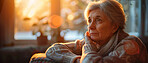 Thoughtful, elderly and woman looking sad. Portrait, senior and mental health concept in the living room. Reflecting, depressed and looking. Background for mental health and reminiscing about past