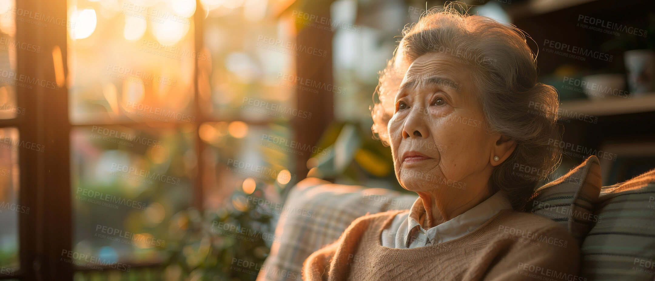 Buy stock photo Thinking, thoughtful and senior Asian woman in retirement home, reflection and remembering past life. Elderly, pensioner and contemplating future or memory, nostalgia with warm sunset background