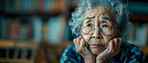 Thinking, depressed and senior Asian woman in retirement home, reflection and remembering past life. Elderly, pensioner and contemplating future or memory, nostalgia with blurred apartment background