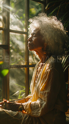 Meditate, elderly African and woman with plants. Senior, retirement and spiritual health in room with large window. Thinking, thoughtful and praying in sunset for worship and lifestyle concept