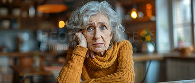 Portrait, elderly and woman sitting at table. Retirement, senior and mental health concept in the living room. Old, thoughtful and looking. kitchen background for mental health and reminiscing about past