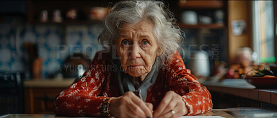 Retired, elderly and woman sitting at table. Portrait, senior and mental health concept in the kitchen. Old, depressed and looking. Dark background for mental health and reminiscing about past