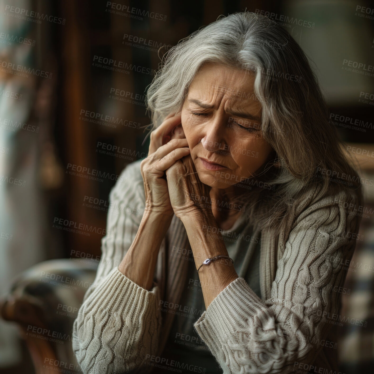 Buy stock photo Depressed, elderly and woman at home. Senior, female and mental health concept in the living room. Sadness, longing and unhappy. Eyes closed, hands folded and praying or hoping on blurry background.