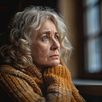 Sad, thinking and senior woman at a window in a home for the morning view, idea or calm. Depressed, thoughtful and an elderly person with hope while in a house during retirement and vision for old age