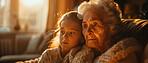 Girl, grandma and sofa for love in bonding time together in home in school holiday. Grandmother, kid and living room care, relationship and time as family connecting on couch in living room