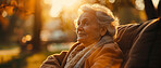 Thoughtful, elderly and woman at home. Senior, female and pensioner concept in the garden or park. Peaceful, longing and thinking. Background, sunset for retirement and reminiscing about past.