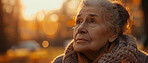 Thoughtful, elderly and woman at home. Senior, female and mental health concept in the living room. Sadness, longing and depressed. Background, sunset for retirement and thinking about past time