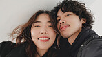 Asian couple selfie portrait in home lounge for love, care and relaxing day together. Faces of smile man, happy woman and loving people enjoying video call, quality time and close marriage bond.