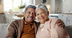 Senior couple, face and hug on couch, smile and bonding with love, support and relax in retirement in home. Elderly woman, old man and portrait with embrace, together and sitting on living room sofa