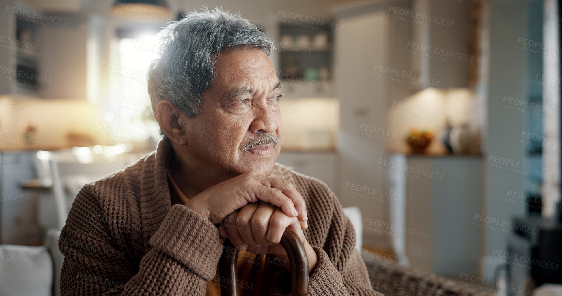 Buy stock photo Thinking, depression and senior man with walking stick on chair with Alzheimer, memory loss or lonely. Face, anxiety and elderly male with a disability and mobility cane in living room sad or stress