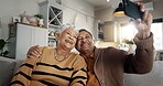 Senior couple, selfie and smile on sofa, hug and bonding with love, support and relax in retirement in home. Elderly woman, old man and happy with profile profile, web blog and social media on couch