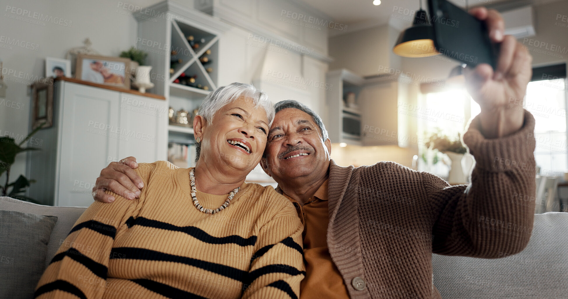 Buy stock photo Senior couple, selfie and smile on sofa, hug and bonding with love, support and relax in retirement in home. Elderly woman, old man and happy with profile profile, web blog and social media on couch