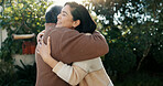 Family, hug and a senior father with his daughter in the garden of a home together for bonding during a visit. Love, smile and retirement with an elderly man embracing a woman outdoor in the backyard
