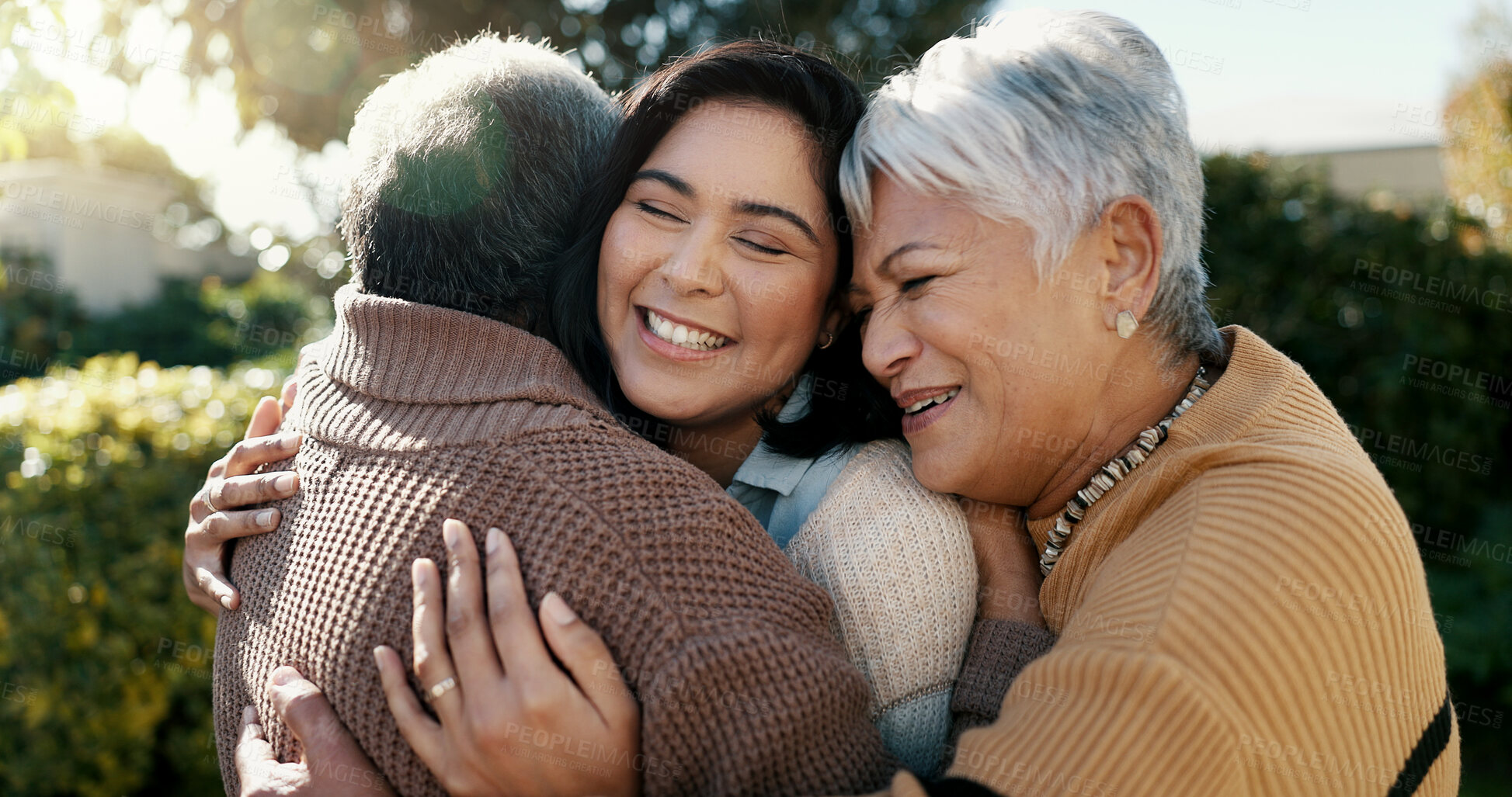 Buy stock photo Mexican family, hug and smile for reunion, outdoors and love for support, retirement and care. Elderly parents and daughter, visit and happy in backyard, bonding and embrace for quality time at home