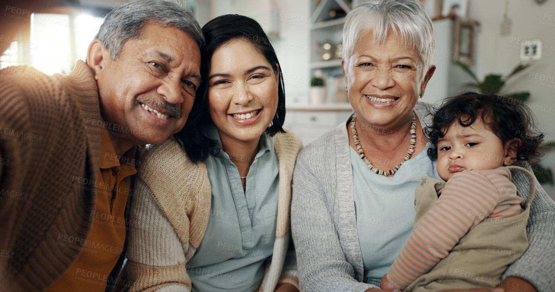 Buy stock photo Happy family, love and selfie in a living room relax, bond and laughing in their home. Portrait, smile and baby with mother and grandparents in a lounge together for profile picture, moment or memory